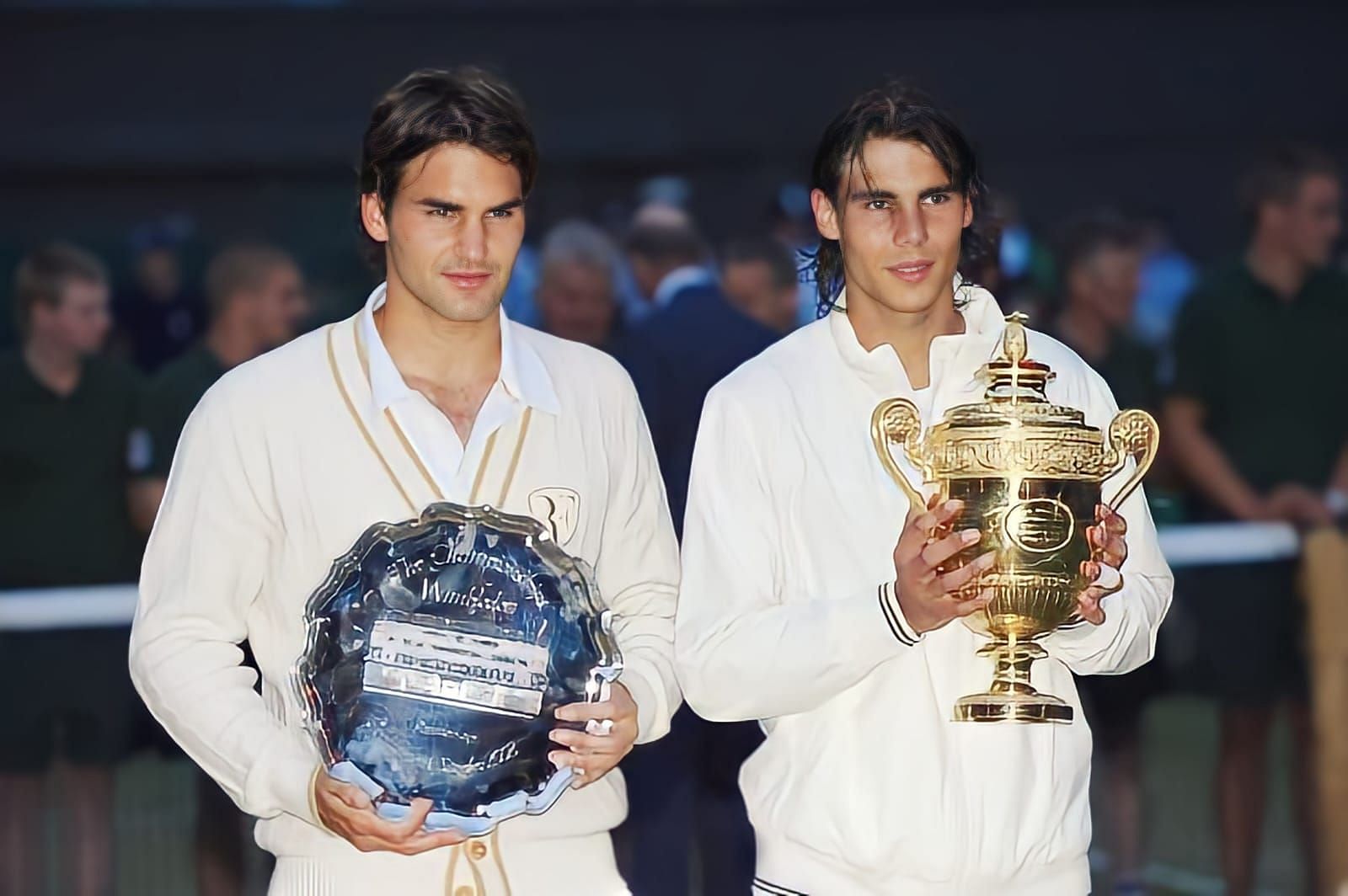 Posing with their titles after the match